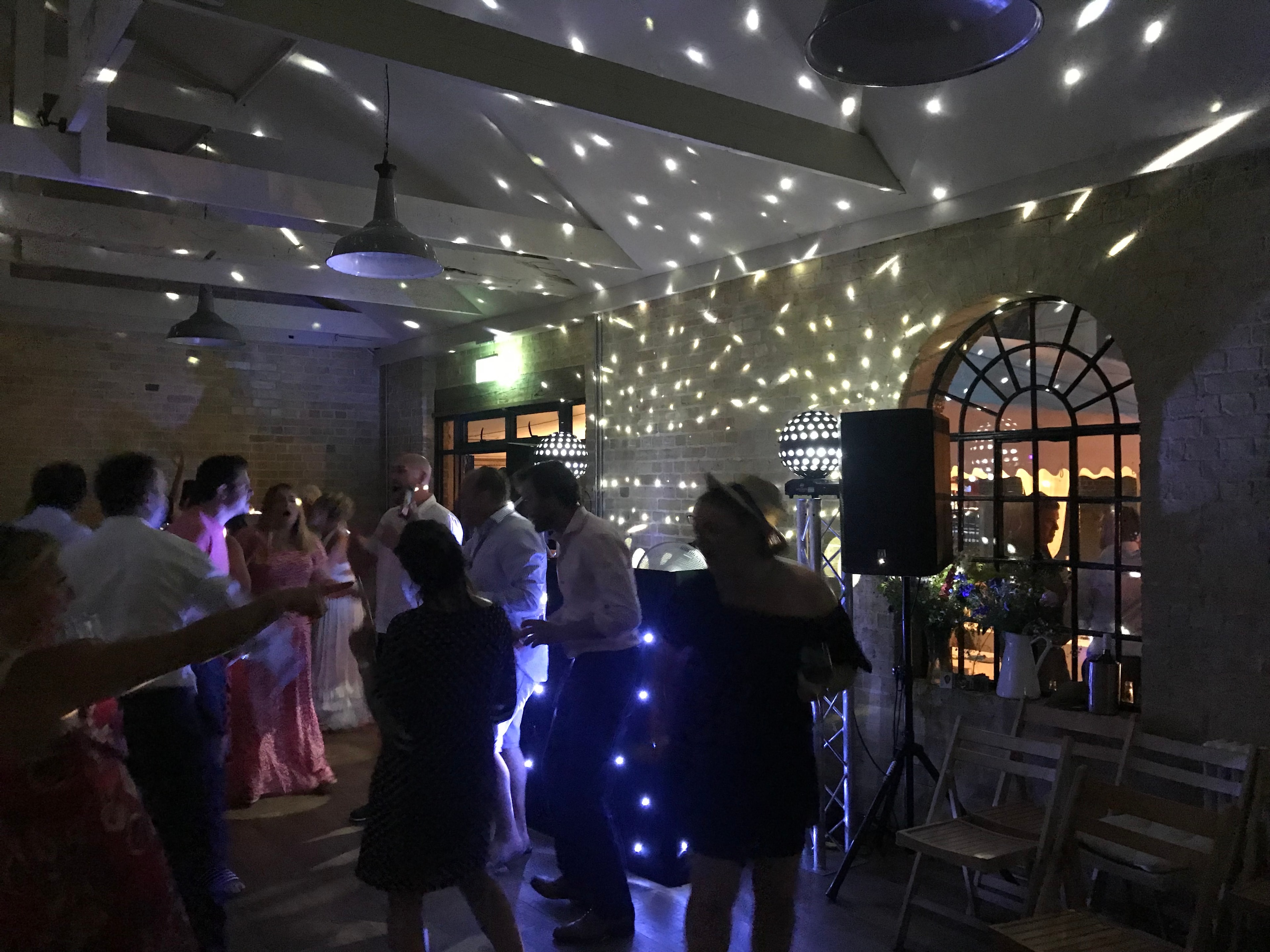 Wedding reception dancing in The Coach House with starlight ceiling