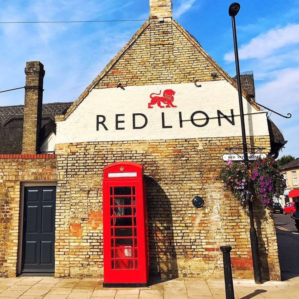 The Red Lion gable end with iconic red telephone box, Soham