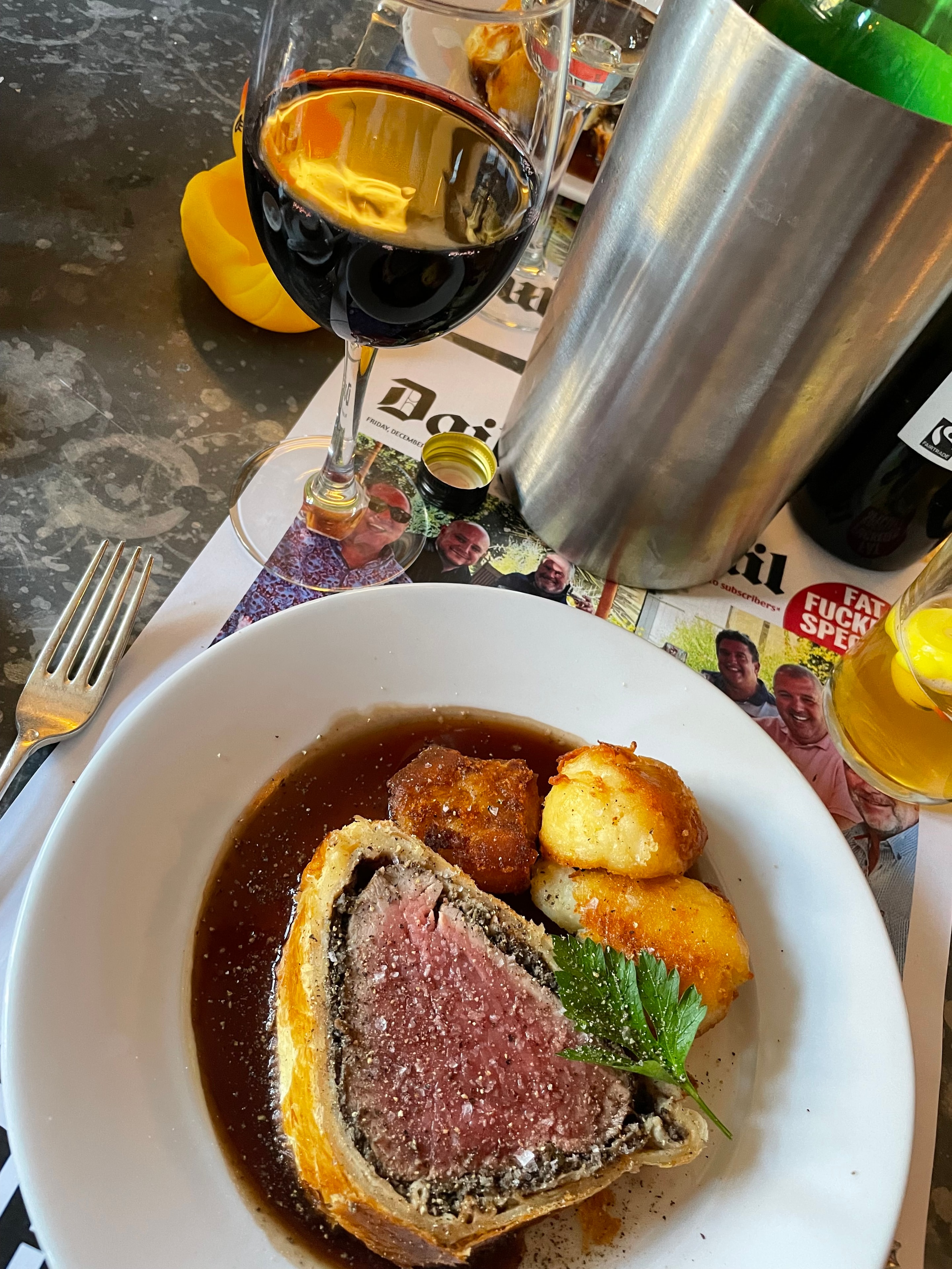 Guest photo: beef Wellington with roast potatoes and red wine at The Red Lion, Soham