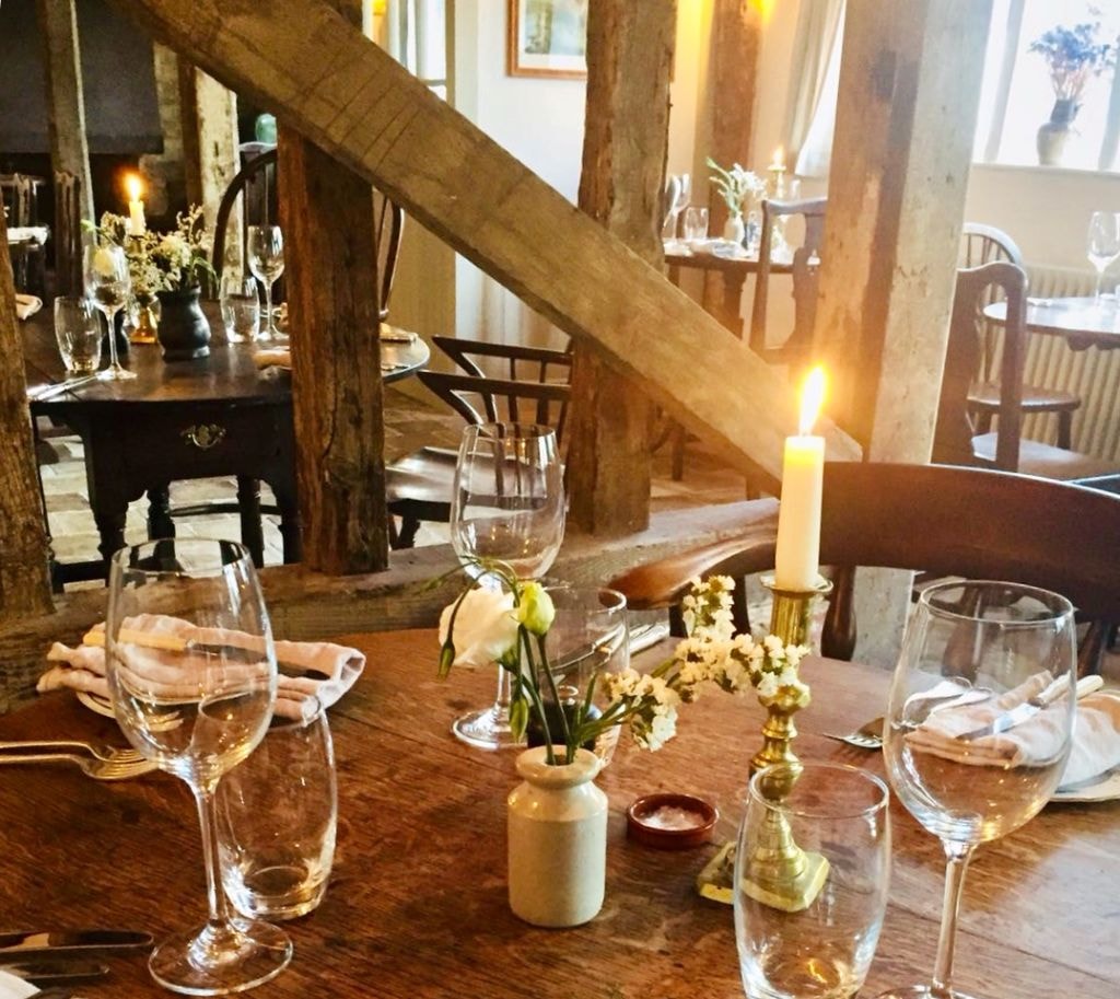 The Oak Room dining tables bathed in summer light